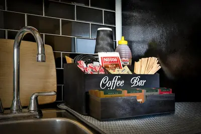a coffee box sitting on top of a kitchen sink at Beautiful APARTMENT - GORGEOUS VIEW of the city - 7 MINUTE WALK TO METRO - SELF CHECK IN in Montréal