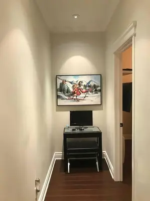 a room with a flat screen tv on a wall at Condo-hôtel Le Champlain - Condo103 Bromont in Bromont