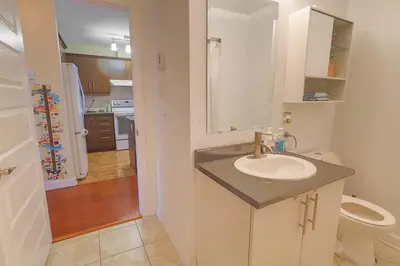a bathroom with a sink and a toilet at Sunset Apartment in Montréal