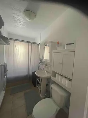 a small bathroom with a toilet and a sink at Le paisible ensoleillé ! beau 51/2 à Drummondville in Drummondville