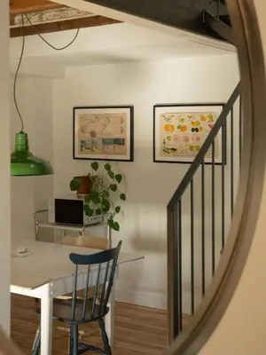 a dining room with a table and a chair at Le Loft par Maison Dudley in Lac-Mégantic