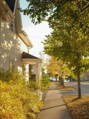 a sidewalk in front of a house at Le Loft par Maison Dudley in Lac-Mégantic