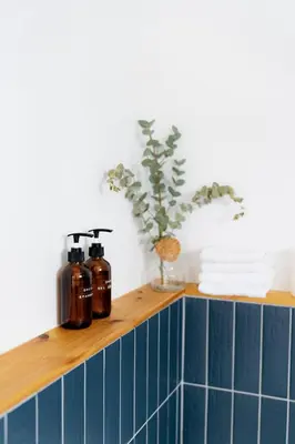 a shelf with two coffee bottles on top of it at Le Boulevard par Maison Dudley in Lac-Mégantic