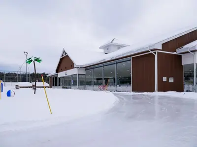 an empty parking lot in front of a building at Chalet Memphrémagog Ski Spa, Étang in Mansonville