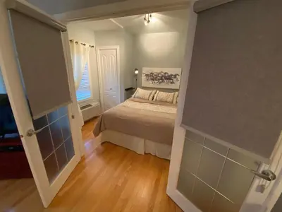 a small bedroom with a bed and a window at ApartHotelMontreal by Les Terrasses Saint Urbain 2225I2 in Montréal