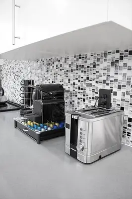 a kitchen with a toasterasteryasteryasteryasteryasteryasteryasteryasteryasteryastery at Chic 1-Bedroom Retreat in Montreal's Vibrant Plateau Mont-Royal Area - Apt 3 in Montréal