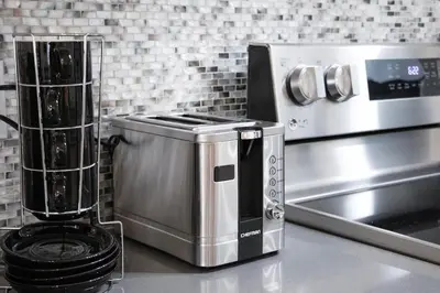 a kitchen with a counter with a toaster and a appliance at Eat, Explore & Enjoy Downtown Montreal at this Sleek City Escape located in Plateau Mont-Royal - Apt 4 in Montréal