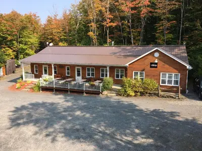a house with a large driveway in front of it at Domaine des Montagnais in Notre-Dame-Des-Bois