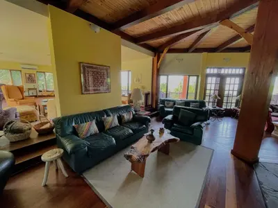 a living room with a couch and a table at Sugar Hill Retreat #296692 in Lac-Brome