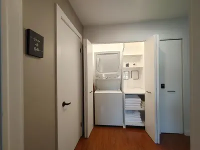 a white refrigerator with its door open in a room at Chalet Évasion Orford in Orford
