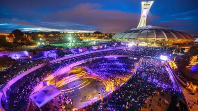 a crowd of people in a stadium at night at Le Mile End by M11 - Neat & Spacious 1BDR Unit in Montréal