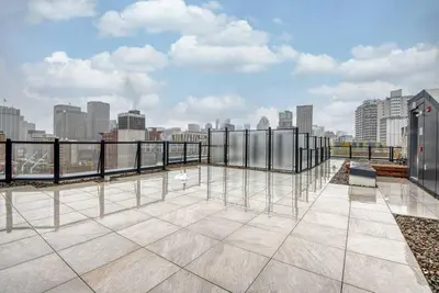 a balcony with a view of a city skyline at 2 bedroom Condo in the heart of the city Montreal in Montréal