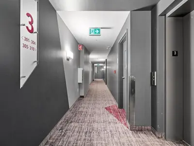 a long hallway with a tile floor in a building at 2 bedroom Condo in the heart of the city Montreal in Montréal