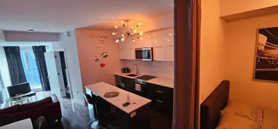 a small kitchen with a table and a counter top at 2 bedroom Condo in the heart of the city Montreal in Montréal