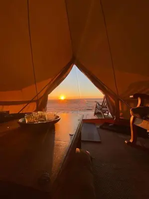 a view from inside a tent with a plate of food at Glamping 4 saisons @ Eco Lodge Bûcheron Bergère in Ormstown