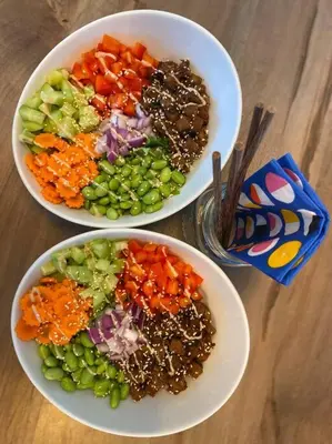 three bowls of vegetables on a wooden table at Glamping 4 saisons @ Eco Lodge Bûcheron Bergère in Ormstown