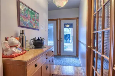 a kitchen with a wooden dresser with a pot on it at La Loggia Art B&B in Montréal