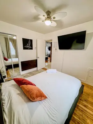 a bedroom with a bed with two pillows on it at Barel Residence Homestay in Longueuil