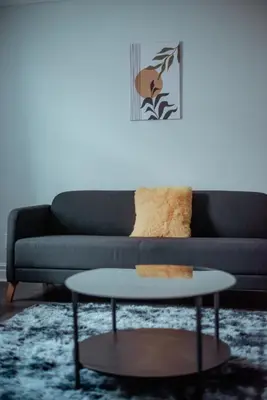 a living room with a couch and a coffee table at Spacieux Appartement de 3 Chambres downtown in Montréal