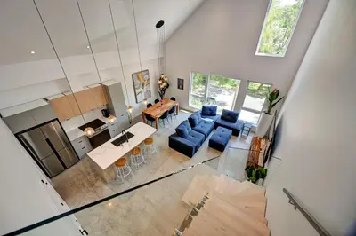an overhead view of a living room and dining room at Luxury Penthouse 3BR 2BR Downtown Private Roof Terrace presented by TripMontreal in Montréal