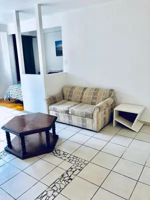 a living room with a couch and a coffee table at Stylish Montreal Apartment: Comfortable Stay in the Golden Square Mile in Montréal