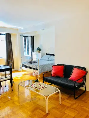 a living room with a couch and a coffee table at Stylish Montreal Apartment: Comfortable Stay in the Golden Square Mile in Montréal