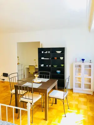 a dining room with a table and chairs at Stylish Montreal Apartment: Comfortable Stay in the Golden Square Mile in Montréal