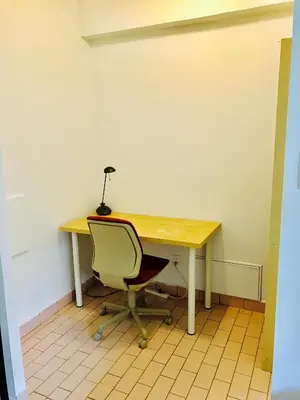 a desk with a chair and a lamp on it at Stylish Montreal Apartment: Comfortable Stay in the Golden Square Mile in Montréal