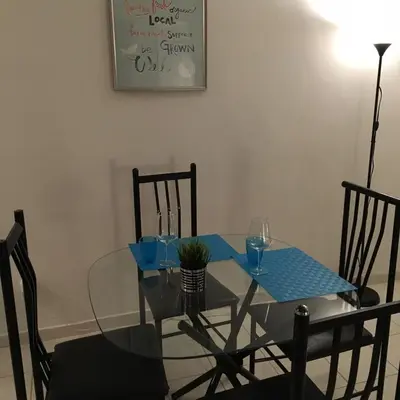 a dining room table with a glass table and chairs at Stylish Montreal Apartment: Comfortable Stay in the Golden Square Mile in Montréal