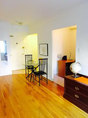 a dining room with a glass table and chairs at Stylish Montreal Apartment: Comfortable Stay in the Golden Square Mile in Montréal