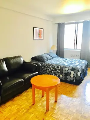 a living room with a couch and a coffee table at Stylish Montreal Apartment: Comfortable Stay in the Golden Square Mile in Montréal