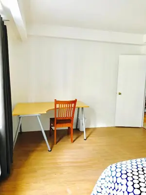 a room with a wooden table and a chair at Stylish Montreal Apartment: Comfortable Stay in the Golden Square Mile in Montréal