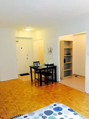 a dining room with a table and two chairs at Stylish Montreal Apartment: Comfortable Stay in the Golden Square Mile in Montréal