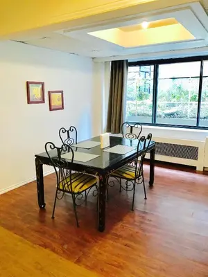 a dining room with a black table and chairs at Stylish Montreal Apartment: Comfortable Stay in the Golden Square Mile in Montréal