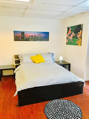 a bedroom with a bed in a room at Stylish Montreal Apartment: Comfortable Stay in the Golden Square Mile in Montréal