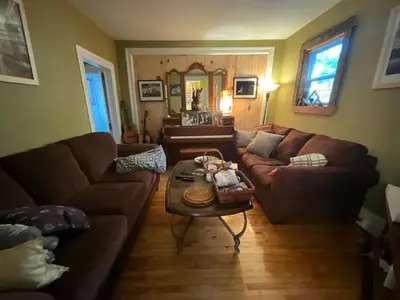 a living room with a couch and a coffee table at L'Oasis Des Nomades in Trois-Rivières