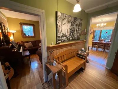 a living room with a couch and a table at L'Oasis Des Nomades in Trois-Rivières