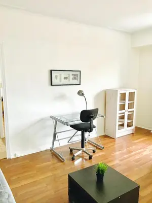 an office with a desk and a chair in a room at Stylish Montreal Apartment: Comfortable Stay in the Golden Square Mile in Montréal