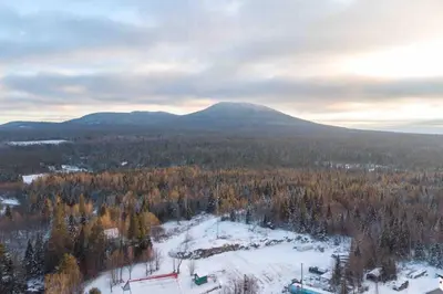 an aerial view of a mountain with snow and trees at Chalet BIA - Le Petit Chaleureux in Ham Nord