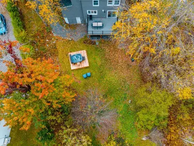 an overhead view of a garden with a painting at lacbrome Chalet lake+Terrasse+BBQ+Hot-tub in Lac-Brome