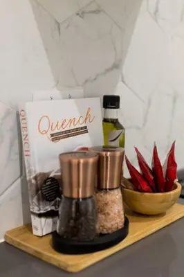 a wooden shelf with a box and some spices at 6768 - 102 Cozy and Fresh Mini Studio with kitchen by Denstays in Montréal