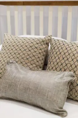 a group of pillows sitting on top of a bed at 6768 - 102 Cozy and Fresh Mini Studio with kitchen by Denstays in Montréal