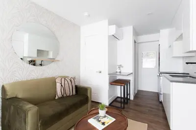 a living room with a couch and a table at 6768 - 202 Amazing mini studio with full kitchen by Denstays in Montréal