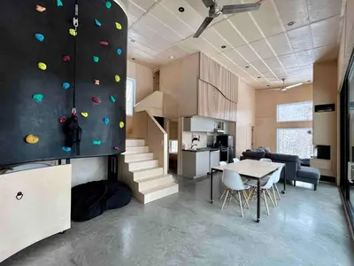 a living room with a rock climbing wall in a house at Cottage Zoobox-style 51 in Eastman