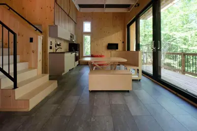 a kitchen and dining room with a table in a house at Cabin Zoobox 57 in Eastman