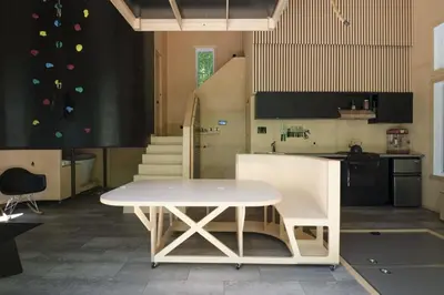 a kitchen with a white table in a room at Cabin Zoobox 75 in Eastman