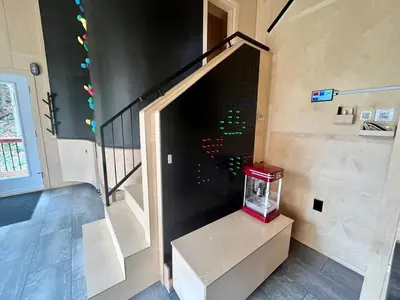 a room with a stair case with a fish bowl on it at Cabin Zoobox 76 in Eastman