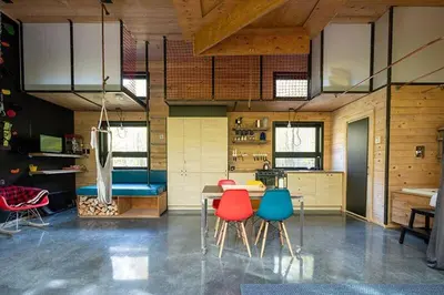 a room with a table and chairs in a kitchen at Cabin Zoobox 62 in Eastman