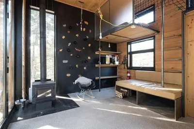 a room with a wall with a climbing wall at Cabin Zoobox 65 in Eastman