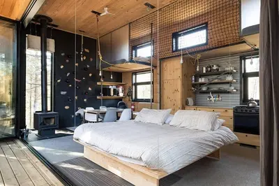a bedroom with a large bed in a room at Cabin Zoobox 65 in Eastman